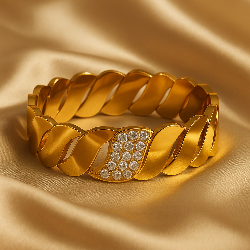 Gold bracelet with diamond accents on a beige fabric background