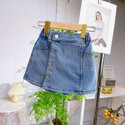 "Blue button-front denim skort combining style and comfort."