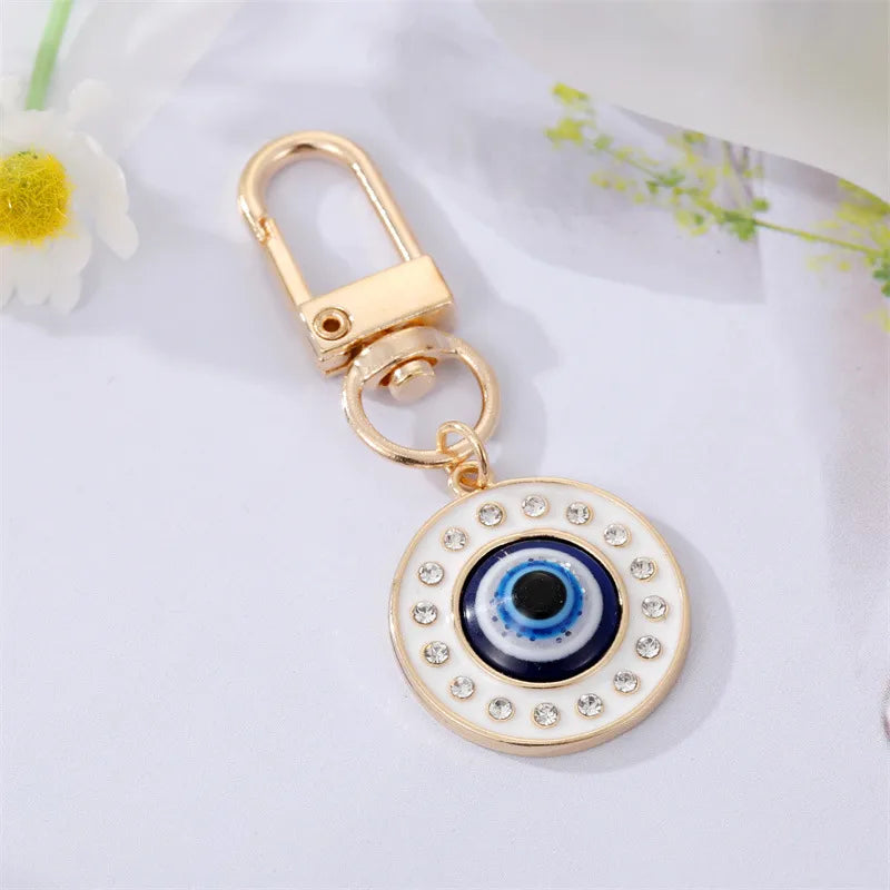 White base evil eye bag charm