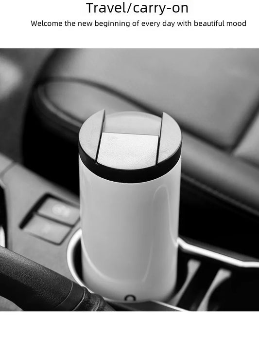 White and black coffe mug placed perfectly in a car cup holder